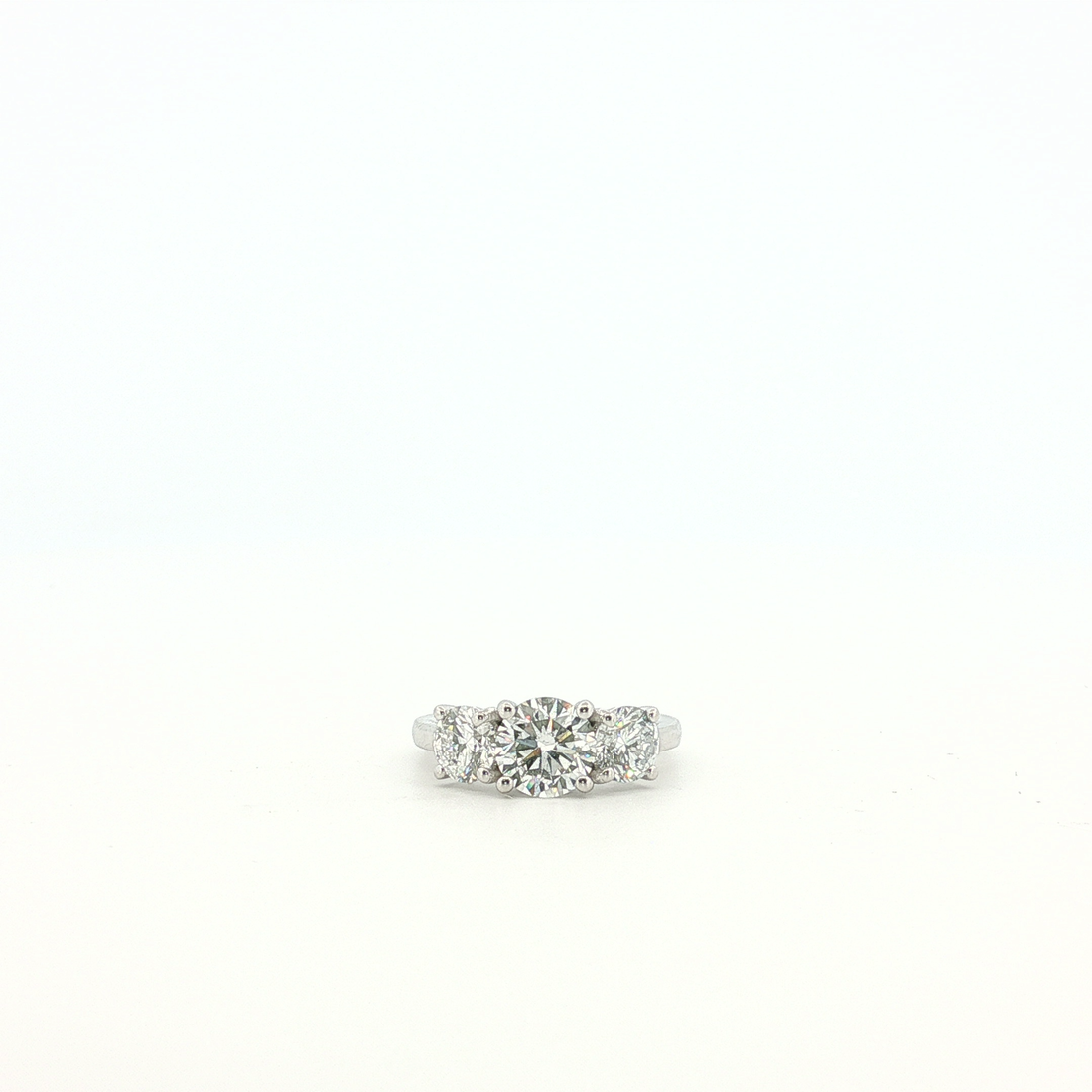 Platinum Three-Stone Ring with Round Brilliant Cut Diamonds